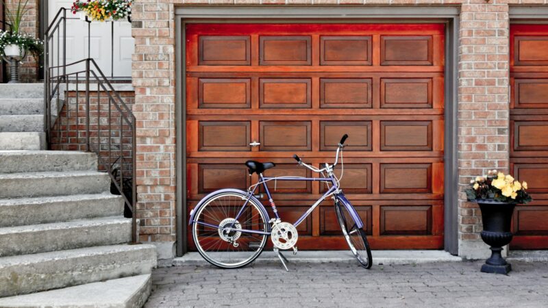 A home garage that needs faux rock siding to improve curb appeal.